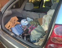 A well wisher brings clothes at HALEA office